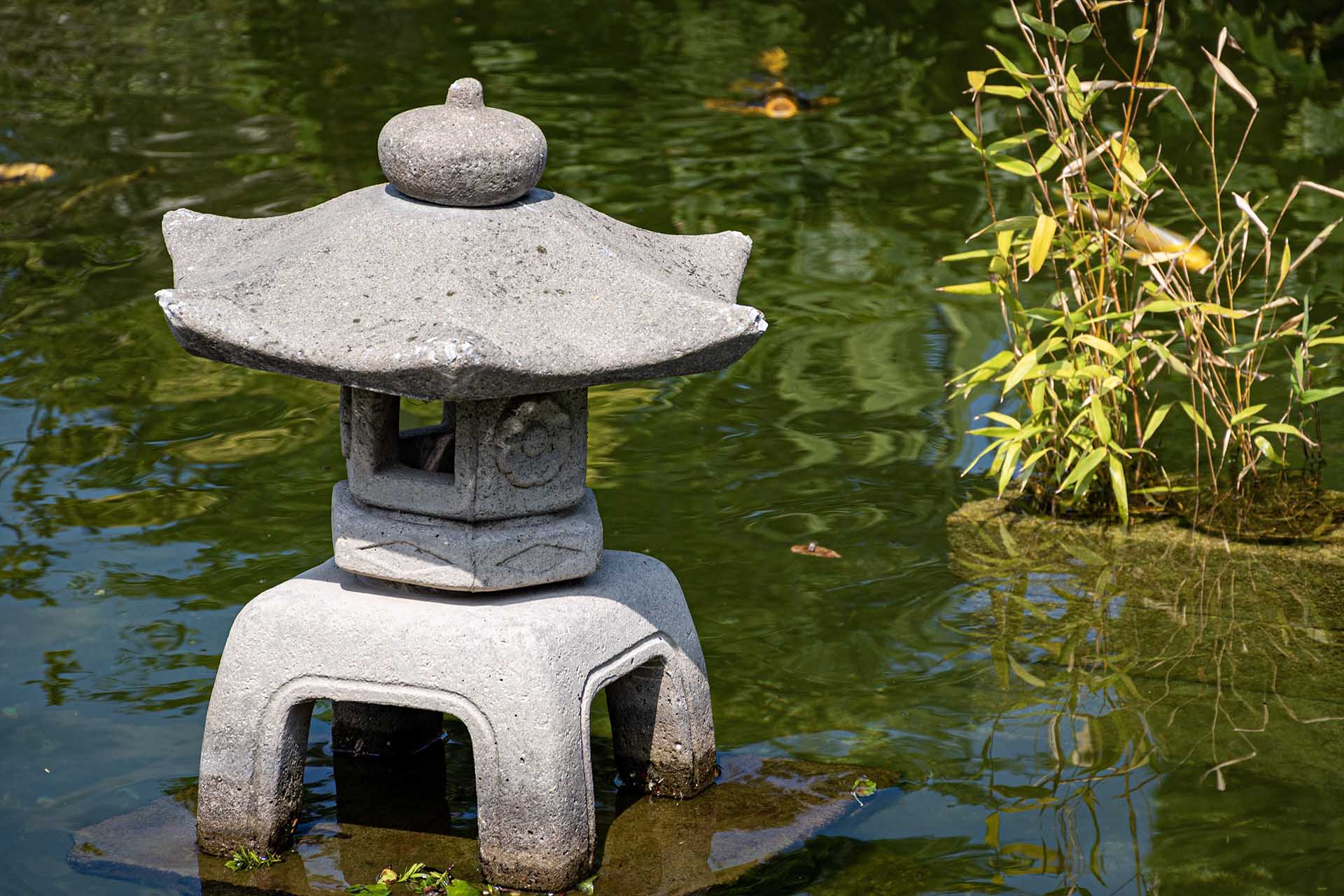 Stone lantern made by cement casting, is already damaged on edge